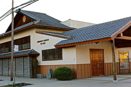 Lodi Winegrape Commission office building in Lodi, California, with traditional architecture and a sign on the wall.