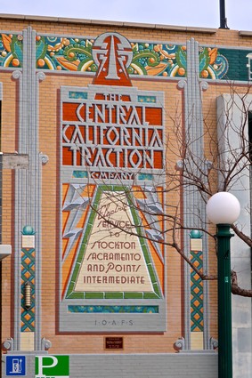 Historic building with colorful mosaic mural promoting Lodi winegrapes and wine industry.