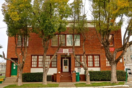 Lodi Winegrape Commission office building with trees and brick facade in Lodi, California.