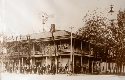 Vintage photo of the Lodi Winegrape Commission building with people gathered outside in early 1900s.