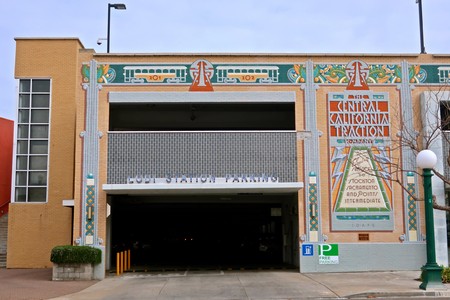 Facade of the Lodi Winegrape Commission building with colorful mural and parking entrance.