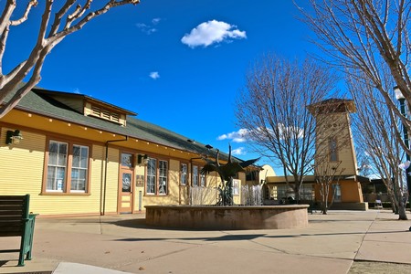 Lodi Winegrape Commission building in a sunny outdoor setting with trees and a clear blue sky.