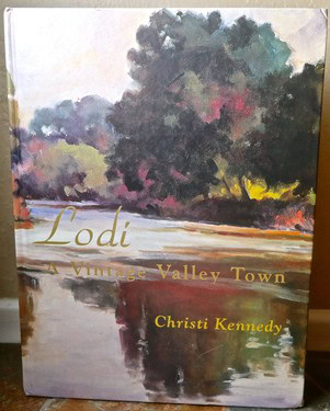 Painting of a vineyard landscape with trees and a river in Lodi, California, by Christi Kennedy.