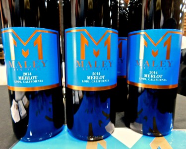 Lodi Merlot wine bottle from 2014 with vibrant blue label and orange accents, showcasing Lodi wine region.