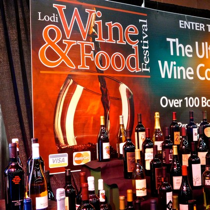 Display of various wine bottles at the Lodi Wine & Food Festival showcasing local wines.