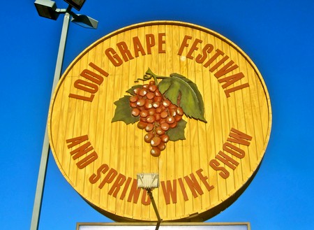 Large circular sign for Lodi Grape Festival and Spring Wine Show with grape cluster graphic.