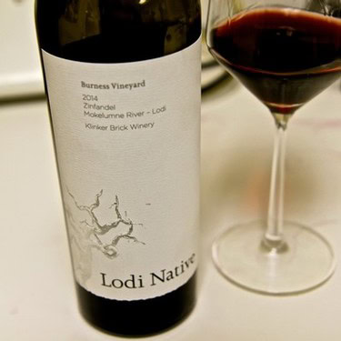 Lodi Native Zinfandel wine bottle from Burness Vineyard in 2014 with a glass of red wine.