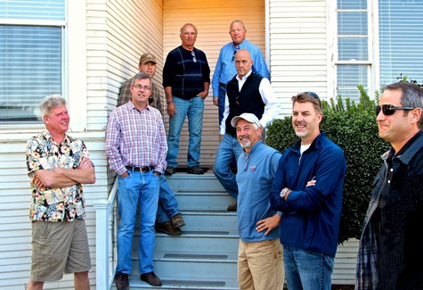 Group of men standing on steps outside a building, representing Lodi Winegrape Commission.