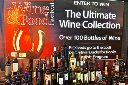 Display of over 100 bottles of wine at the Lodi Wine & Food Festival showcasing diverse wine options.