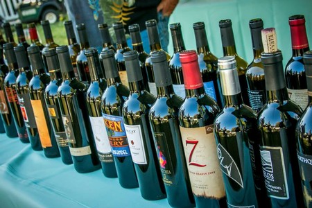Selection of wine bottles from Lodi Winegrape Commission showcasing diverse varieties and labels.