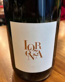 Close-up of a wine bottle label from Lodi Winegrape Commission, showcasing elegant design and branding.