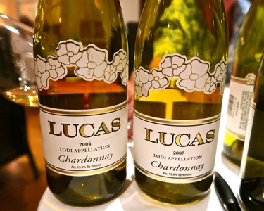 Two bottles of Lodi Chardonnay wine from the Lodi Winegrape Commission, vintage 2004 and 2007, on display.