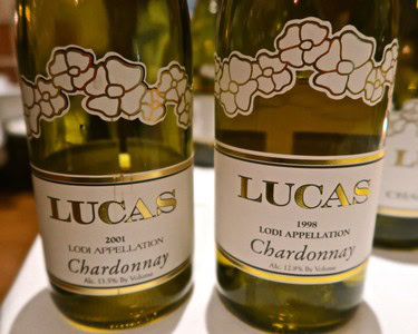 Two bottles of Lodi Chardonnay wine from 2001 and 1998 with vineyard labels.