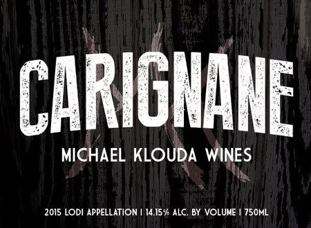 Close-up of Carignan wine bottle label from Michael Klouda Wines, Lodi, showcasing vintage and alcohol content details.