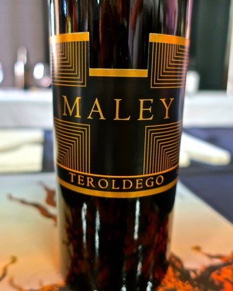 Close-up of Maley Teroldego wine bottle from Lodi Winegrape Commission, showcasing elegant label design.