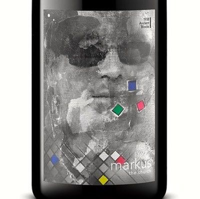 Black and white image of a person wearing sunglasses with colorful geometric shapes overlay, promoting Lodi wine.