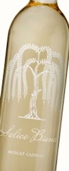 Close-up of a Lodi Winegrape Commission wine bottle with a white label and gold cap.