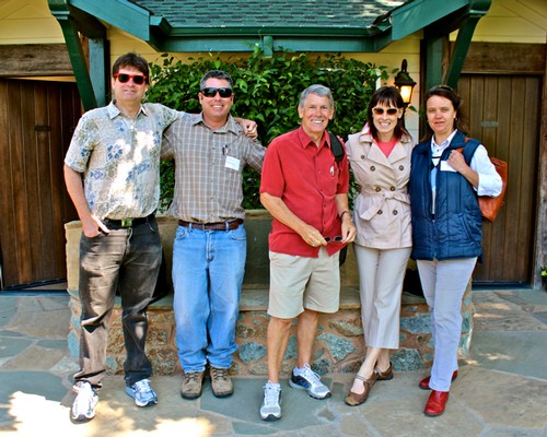 Group of five people smiling outdoors at Lodi Winegrape Commission event.