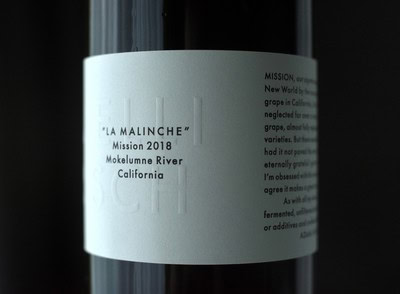 Close-up of a wine bottle label from Lodi Winegrape Commission, showcasing 'La Malinche' 2018 from California.