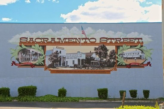 Colorful mural on Sacramento Street in Lodi featuring historic buildings and local landmarks.