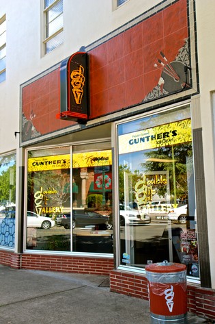 Gunter's ice cream shopfront with bright yellow signage and large glass windows in Lodi, California.