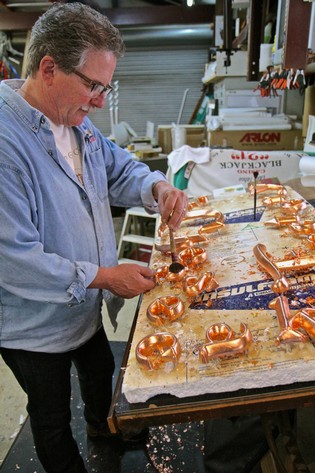 Artisan creating copper glass sculptures at Lodi Winegrape Commission workshop.