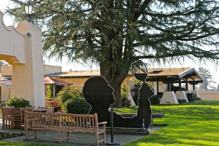 Outdoor sculpture at Lodi Winegrape Commission featuring a wine glass and grapevine design.