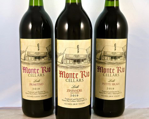 Three bottles of Lodi wine from Monte Rio Cellars, featuring Primitivo, Zinfandel, and Petite Sirah, on a white background.