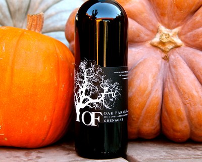 Bottle of Oak Farm Grenache wine with pumpkins in the background for Lodi Winegrape Commission.