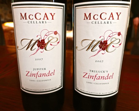 Two bottles of McCAY Cellars 2007 Zinfandel wine from Lodi, California, with elegant labels featuring red grape illustrations.