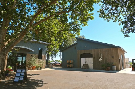 Lodi Winegrape Commission building with trees and clear sky in the background.