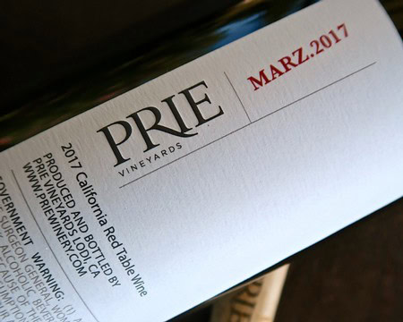 Close-up of a wine bottle label from Lodi Winegrape Commission, showing vintage and vineyard details.