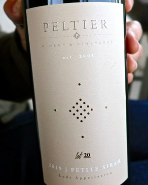 Close-up of a Peltier Winery bottle label from Lodi, California, showcasing vintage 2019 Petite Sirah.