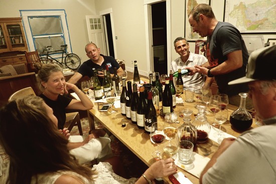Group of people enjoying wine tasting at a Lodi Winegrape Commission event.