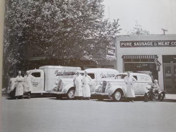 Vintage black and white photo of Lodi Winegrape Commission with delivery trucks and workers.
