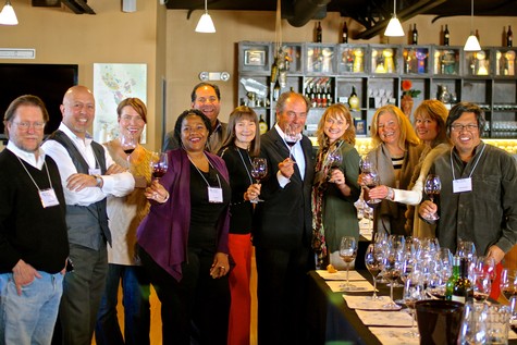 Group of diverse people celebrating with wine glasses at a wine tasting event in Lodi, California.