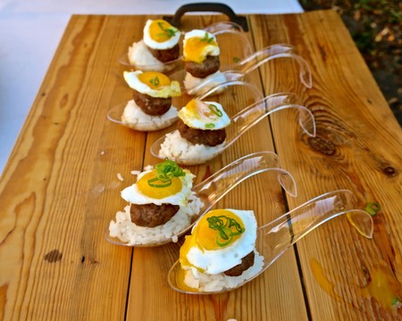 Tasting appetizers with meatballs, lemon slices, and herbs on wooden table for Lodi Winegrape Commission.