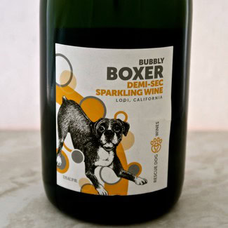 Bottle of Boxer Demi-Sec Sparkling Wine from Lodi, California with a playful dog illustration on the label.