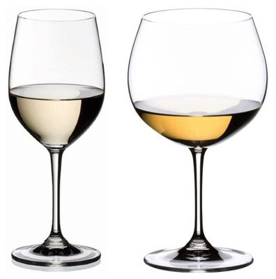 Two wine glasses, one with white wine and one with red wine, on a white background.