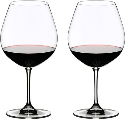 Two wine glasses filled with red wine, side by side, on a white background.