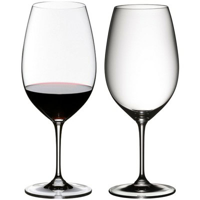 Two clear wine glasses, one filled with red wine, on a white background, showcasing wine tasting and wine appreciation.