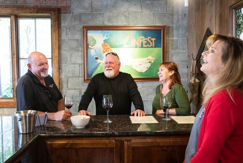 Group of people enjoying wine tasting at Lodi Winegrape Commission event Zinfest.