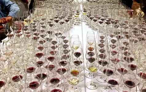 Extensive wine glass display at a wine tasting event by the Lodi Winegrape Commission.