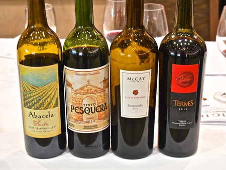 Four bottles of Lodi wine from the Winegrape Commission, showcasing different labels and varieties.