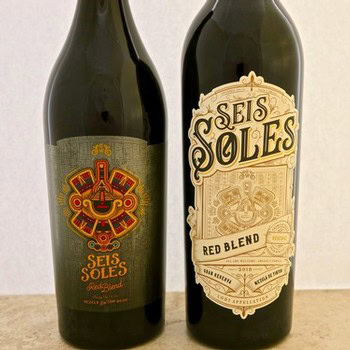 Two wine bottles from Lodi Winegrape Commission, featuring Seis Soles Red Blend and another wine, on a neutral background.