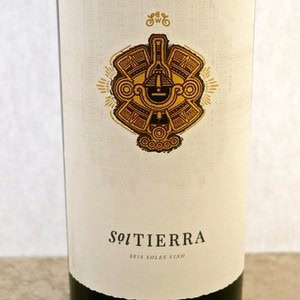 Close-up of Lodi Winegrape Commission wine bottle label with intricate design and logo.