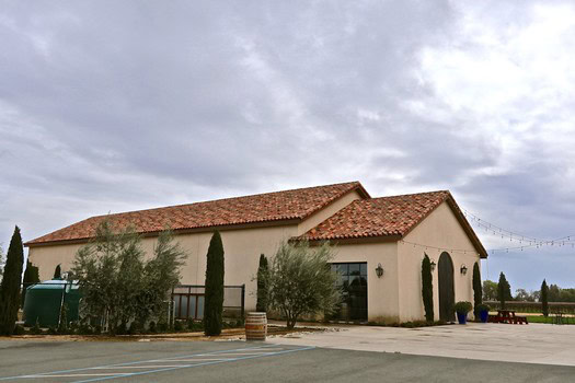 Lodi Winegrape Commission building with vineyard landscape in the background.