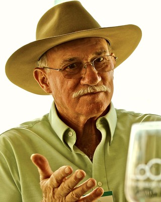 Portrait of an elderly man with a hat and glasses, representing Lodi Winegrape Commission.