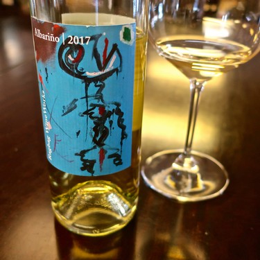 2017 Albarino wine bottle from Lodi Winegrape Commission with a glass of white wine.