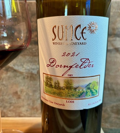 2021 Donfeldter dry wine from Lodi Winegrape Commission, showcasing lush vineyard scenery on label.